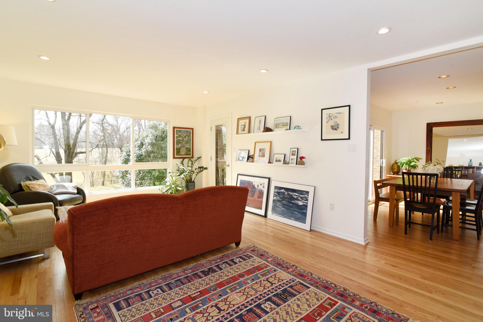 11749 Indian Ridge Road Reston, VA 20191 - Photo 14 of 53 a living room with furniture and a wooden floor