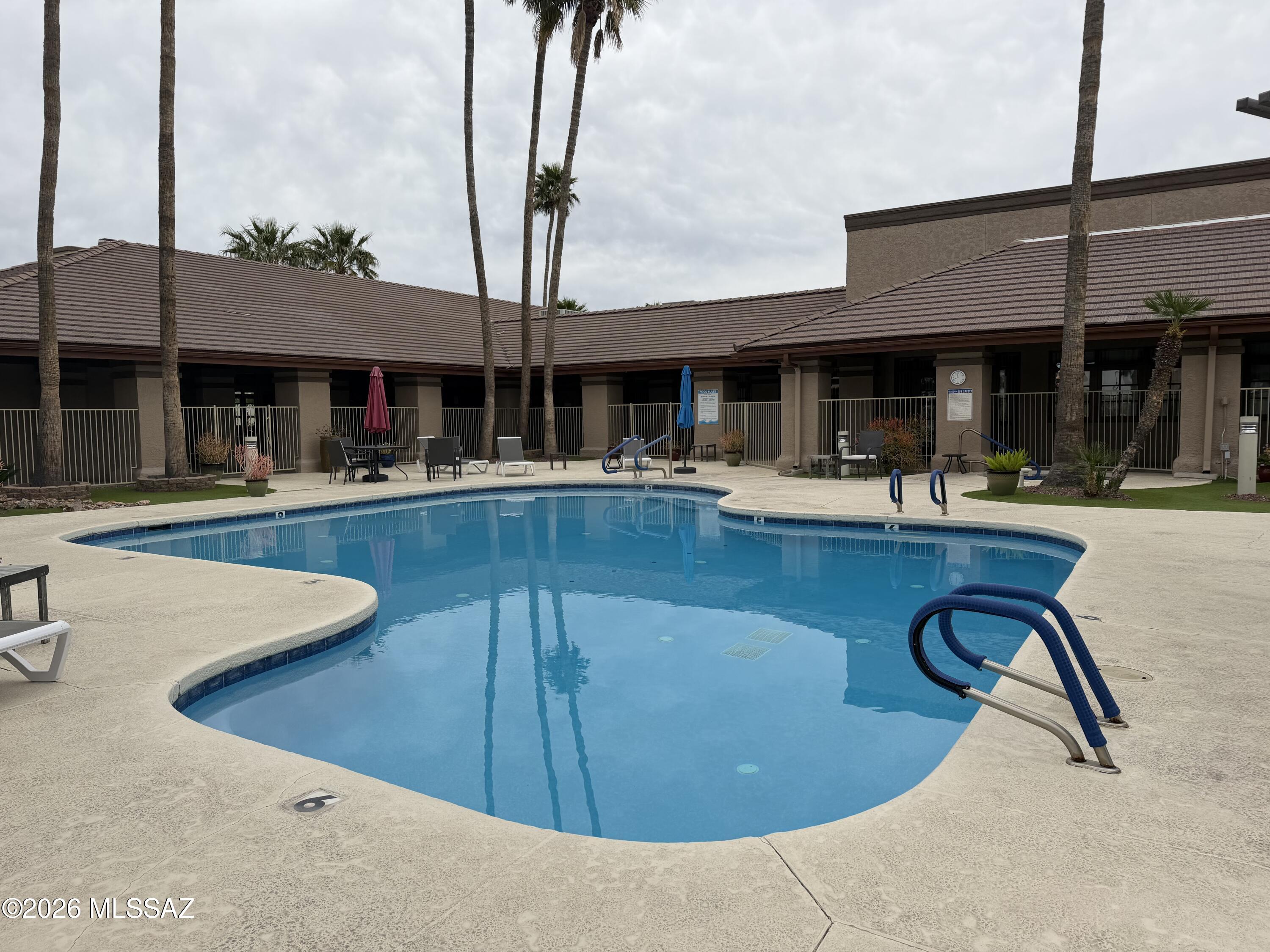 8401 South Kolb Road, Unit 168 Tucson, AZ 85756 - Photo 17 of 20 a view of a house with swimming pool and sitting area