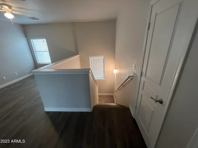a view of stairs and utility room