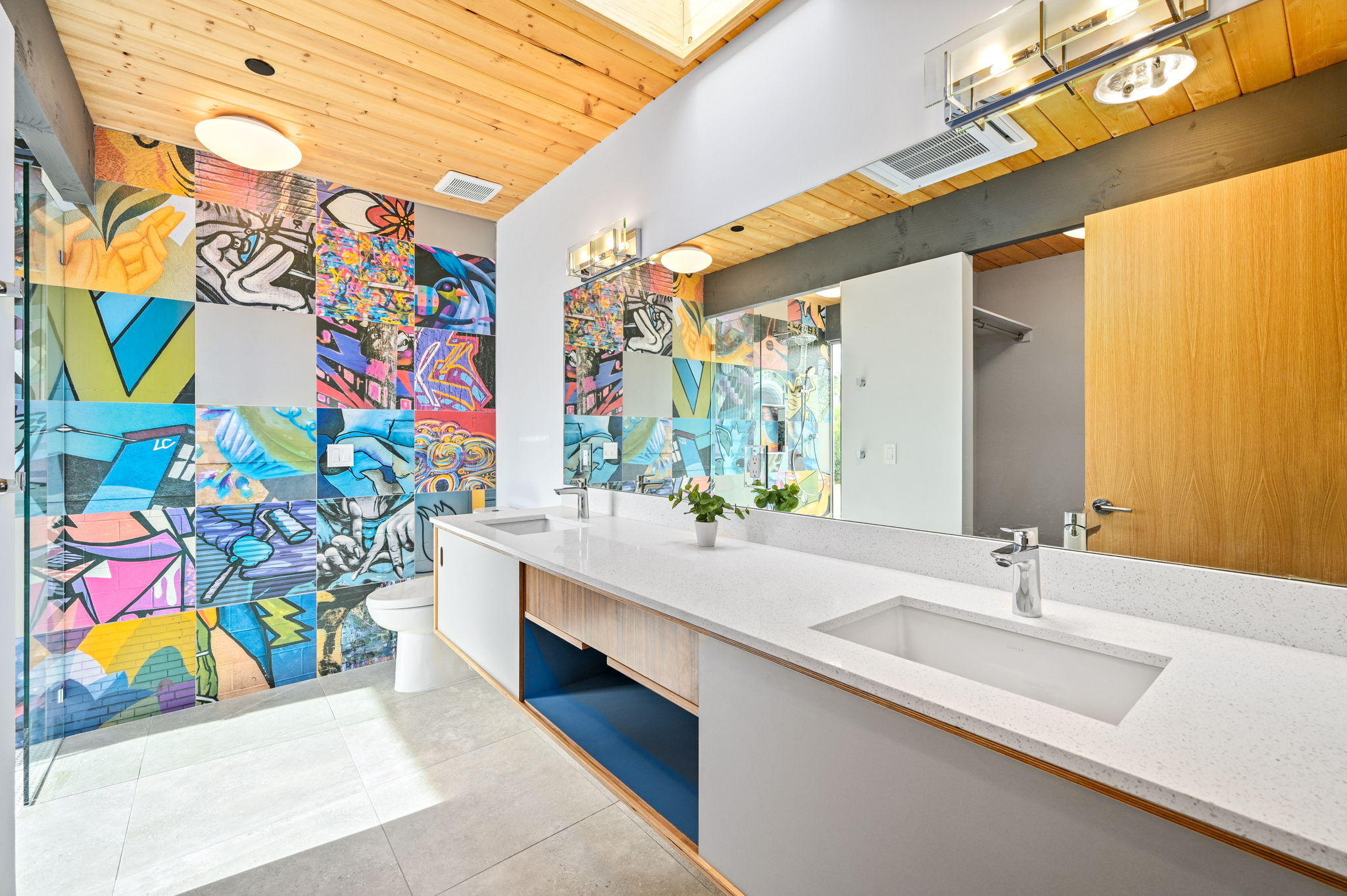 36668 Palm View Road Rancho Mirage, CA 92270 - Photo 22 of 49 a bathroom with painting on the wall and a sink