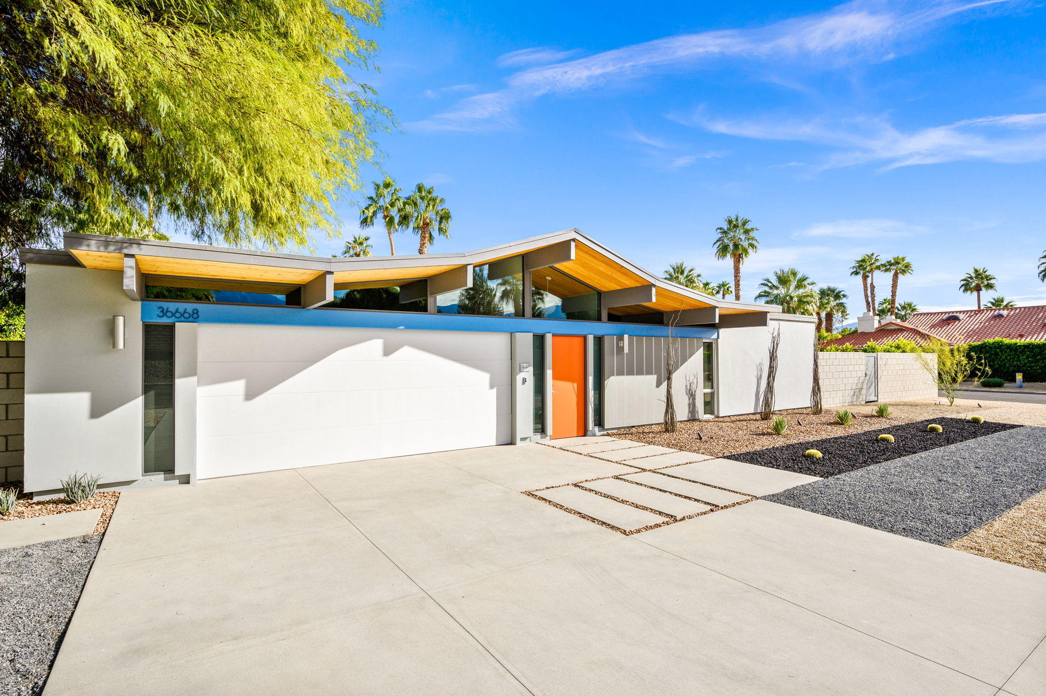 36668 Palm View Road Rancho Mirage, CA 92270 - Photo 5 of 49 a view of a house with a yard and garage