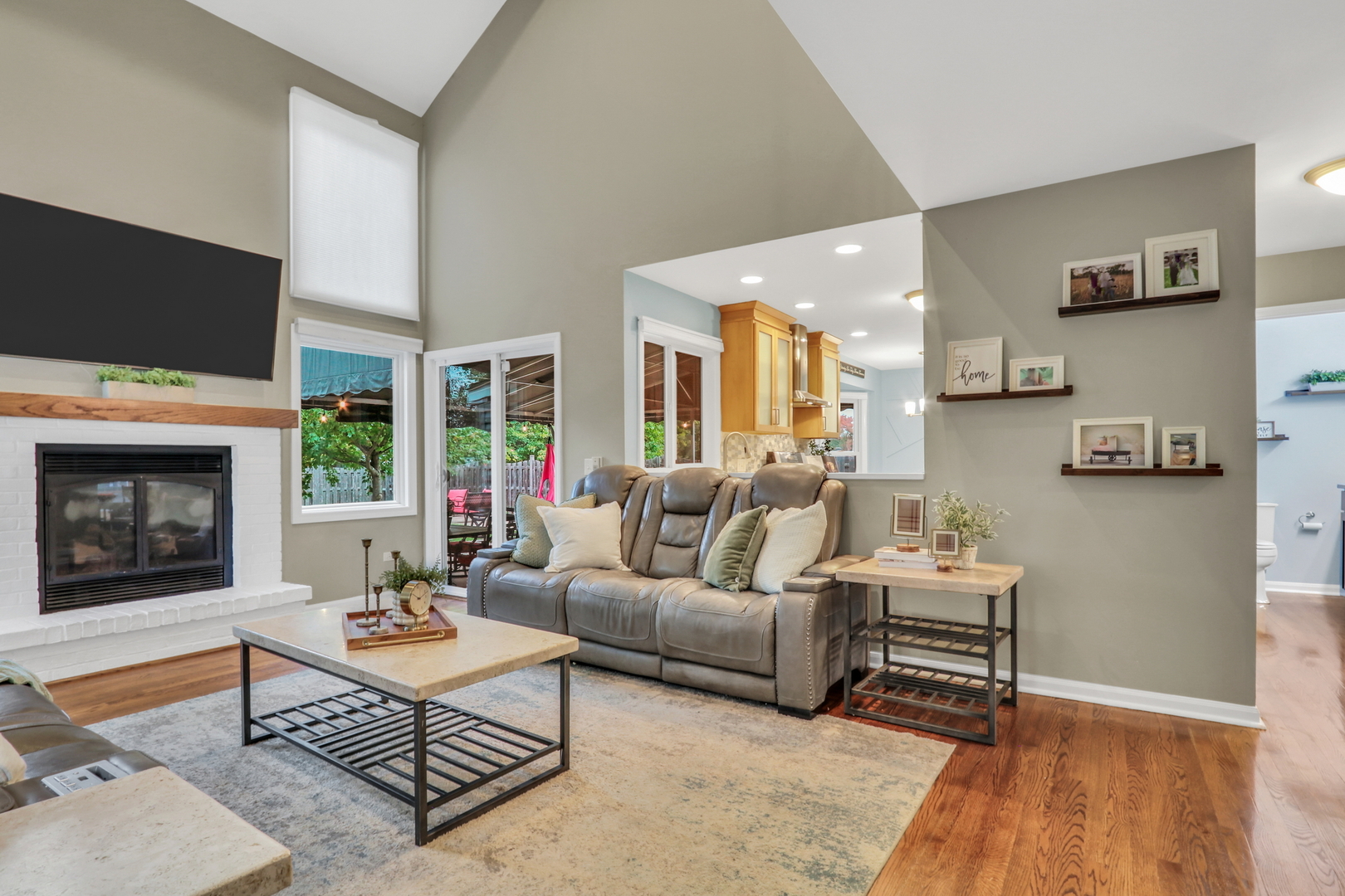 6183 Old Farm Lane Gurnee, IL 60031 - Photo 17 of 52 a living room with furniture a flat screen tv and a fireplace