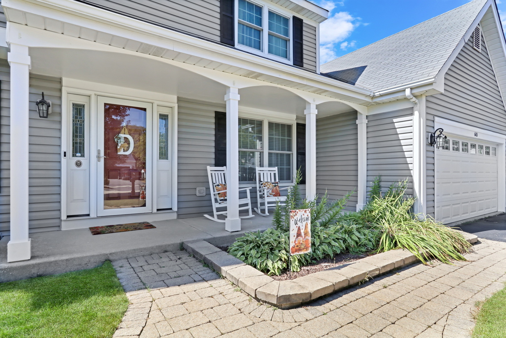 6183 Old Farm Lane Gurnee, IL 60031 - Photo 2 of 52 a front view of a house with garden