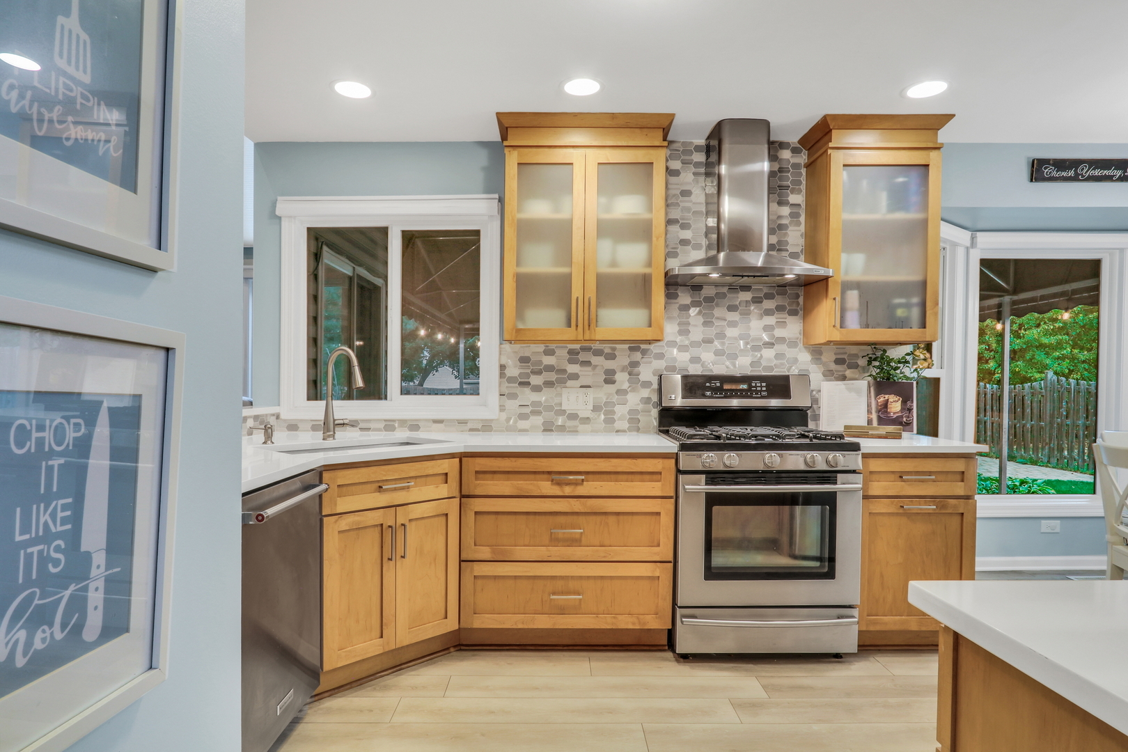 6183 Old Farm Lane Gurnee, IL 60031 - Photo 7 of 52 a kitchen with stainless steel appliances granite countertop a stove and a sink