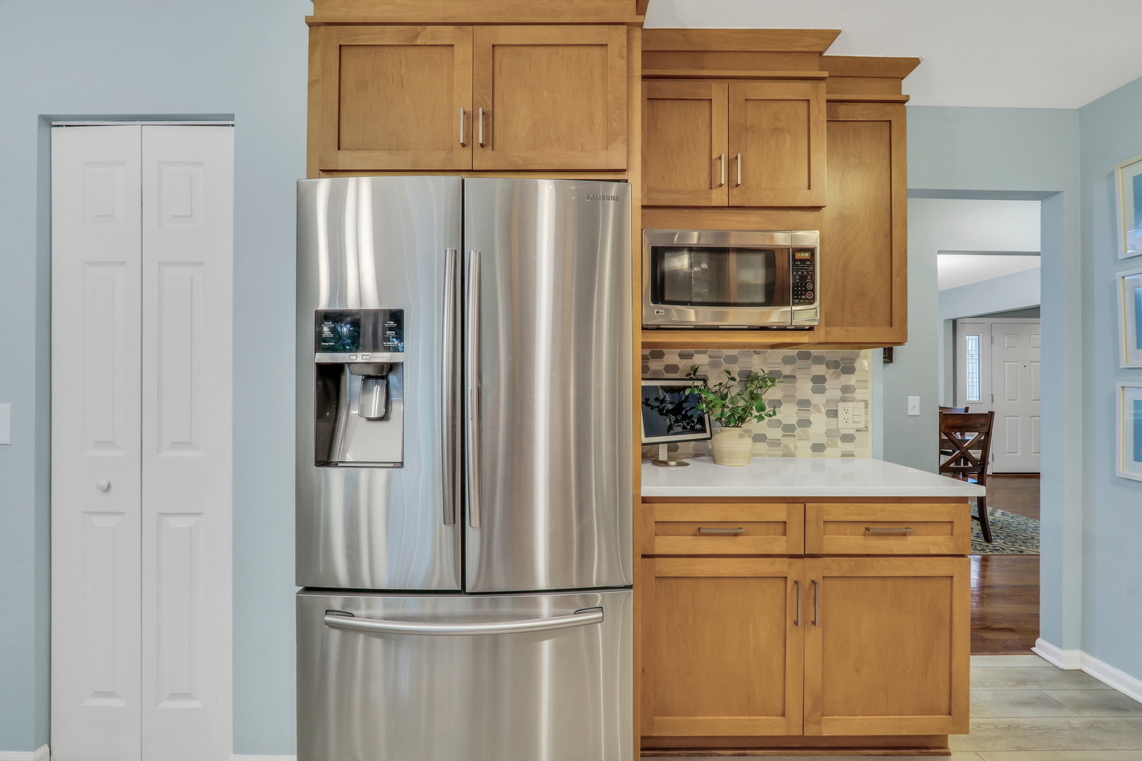 6183 Old Farm Lane Gurnee, IL 60031 - Photo 9 of 52 a kitchen with stainless steel appliances wooden cabinets and a refrigerator