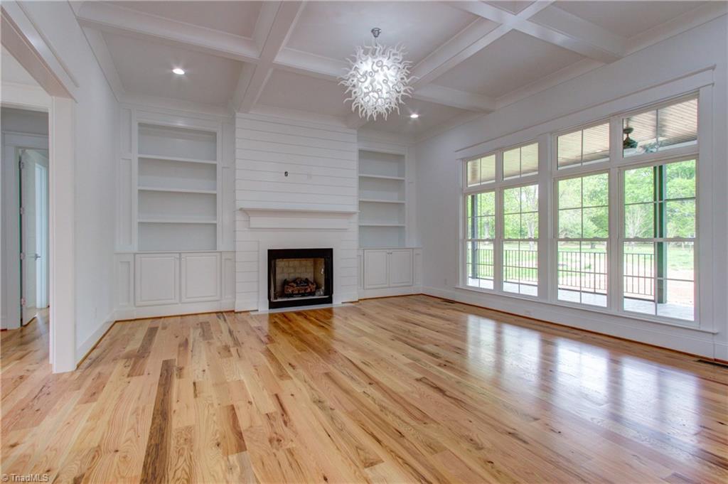 8406 Wolf Ridge Trail Oak Ridge, NC 27310 - Photo 14 of 46 Great room has plenty of windows. 11'6" coffered ceiling.