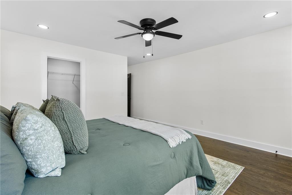 968 Bruce Circle Southeast Atlanta, GA 30316 - Photo 13 of 40 a bed room with a bed and a ceiling fan