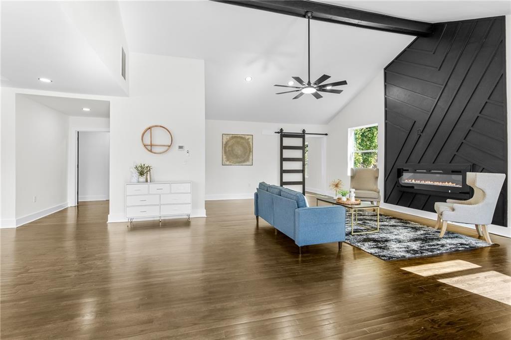 968 Bruce Circle Southeast Atlanta, GA 30316 - Photo 5 of 40 a living room with fireplace furniture and a wooden floor