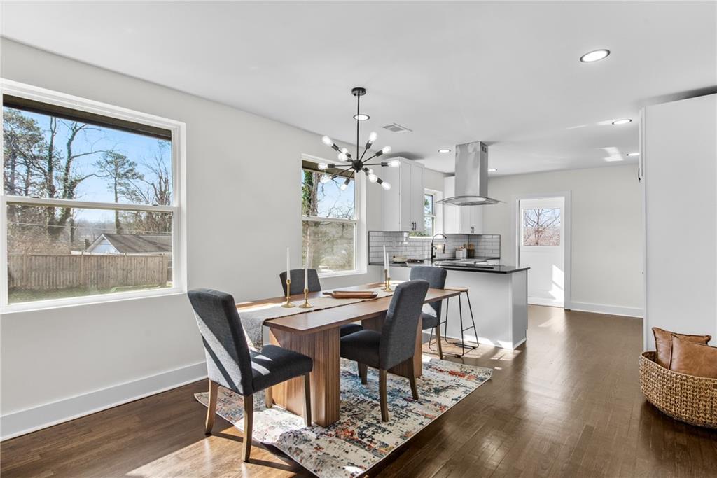 968 Bruce Circle Southeast Atlanta, GA 30316 - Photo 7 of 40 a view of a dining room with furniture window and wooden floor