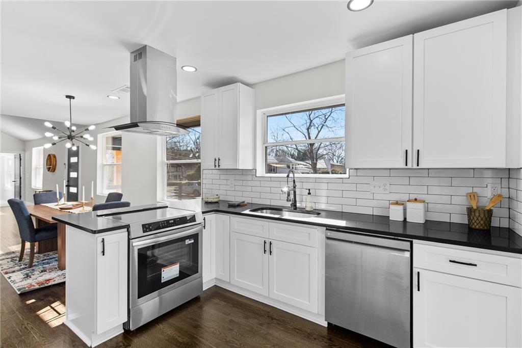 968 Bruce Circle Southeast Atlanta, GA 30316 - Photo 9 of 40 a kitchen with a sink stove and cabinets