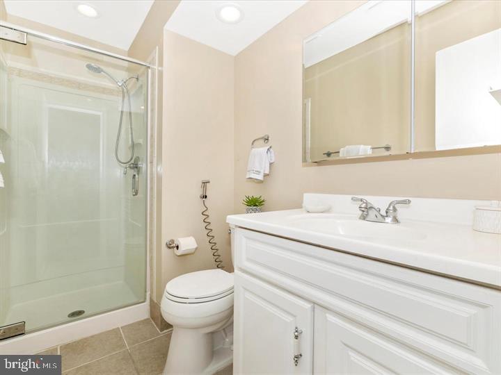 20105 Waringwood Way Gaithersburg, MD 20886 - Photo 12 of 39 a bathroom with a granite countertop sink a toilet and shower