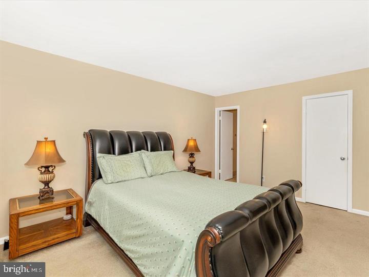 20105 Waringwood Way Gaithersburg, MD 20886 - Photo 13 of 39 a bedroom with a bed and window