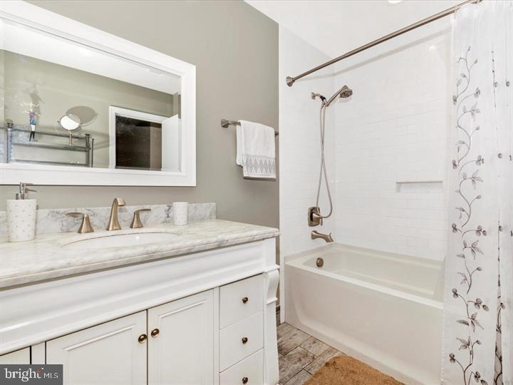 20105 Waringwood Way Gaithersburg, MD 20886 - Photo 16 of 39 a bathroom with a granite countertop sink a toilet and shower