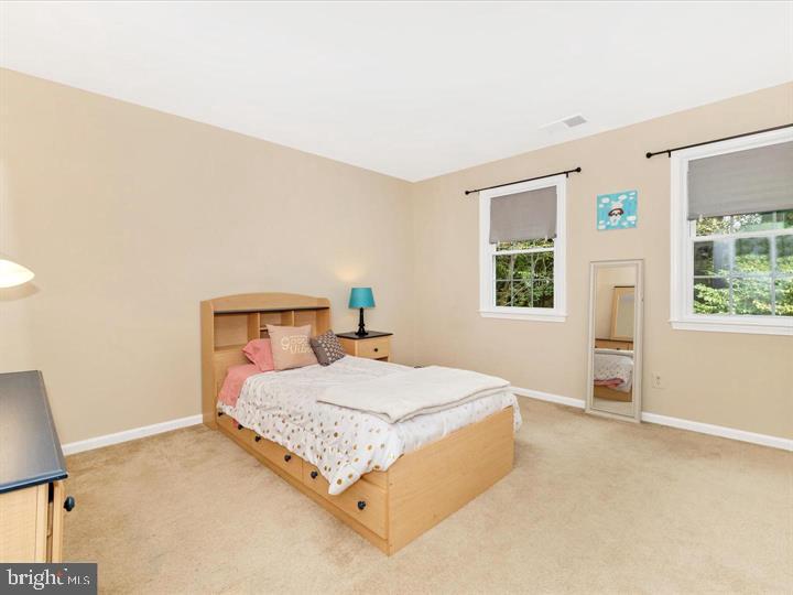 20105 Waringwood Way Gaithersburg, MD 20886 - Photo 19 of 39 a bedroom with a bed and a window