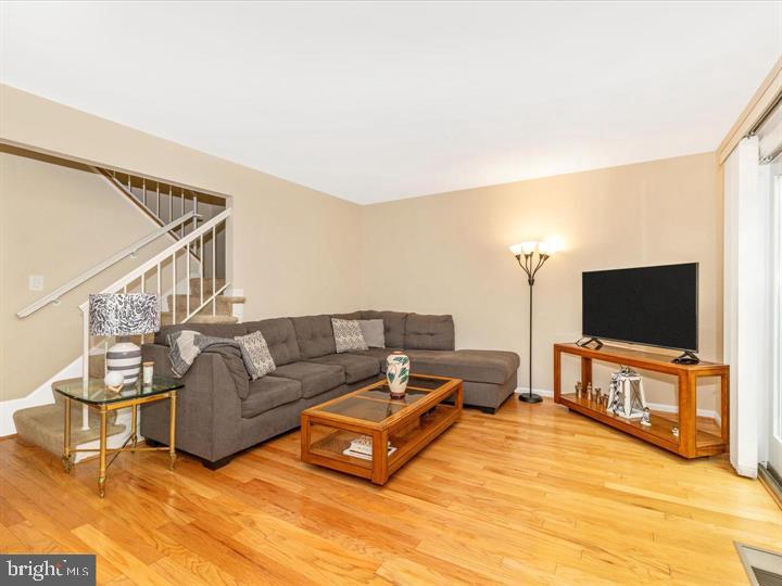 20105 Waringwood Way Gaithersburg, MD 20886 - Photo 21 of 39 a living room with furniture and a flat screen tv