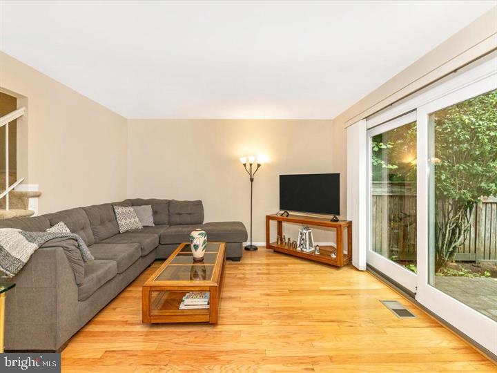 20105 Waringwood Way Gaithersburg, MD 20886 - Photo 23 of 39 a living room with furniture and a flat screen tv