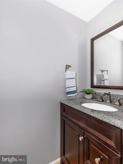 20105 Waringwood Way Gaithersburg, MD 20886 - Photo 10 of 39 a bathroom with a granite countertop sink and a mirror