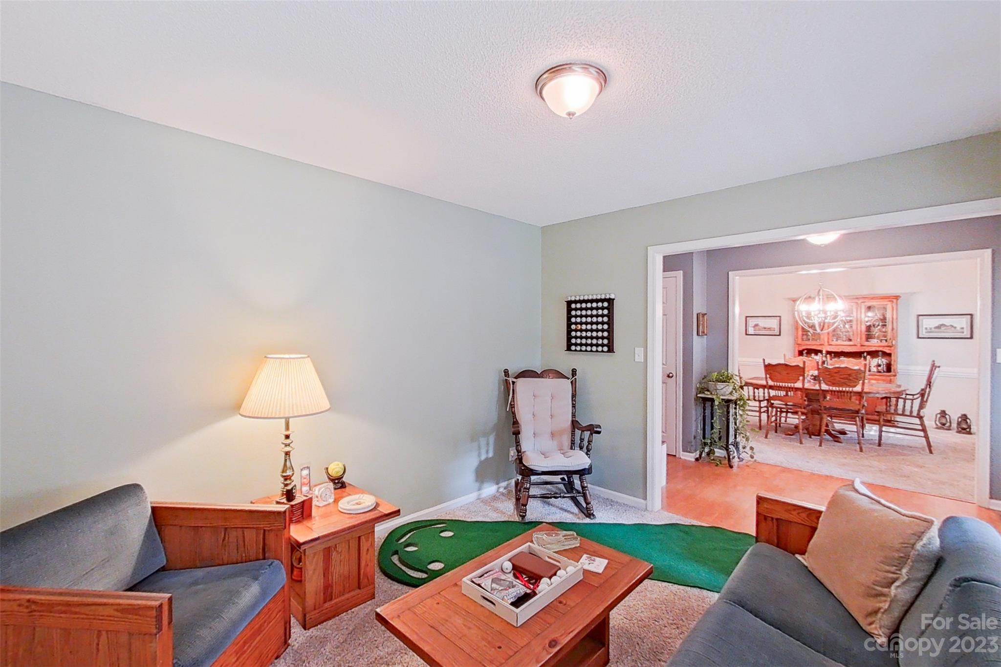 358 Maple Ridge Circle Salisbury, NC 28147 - Photo 13 of 48 a living room with furniture and a wooden floor