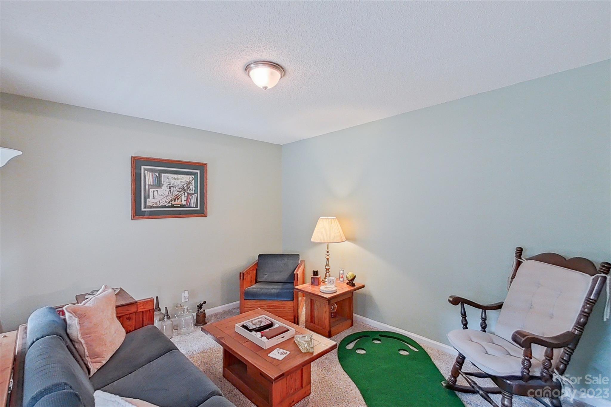 358 Maple Ridge Circle Salisbury, NC 28147 - Photo 15 of 48 a living room with furniture and a chair