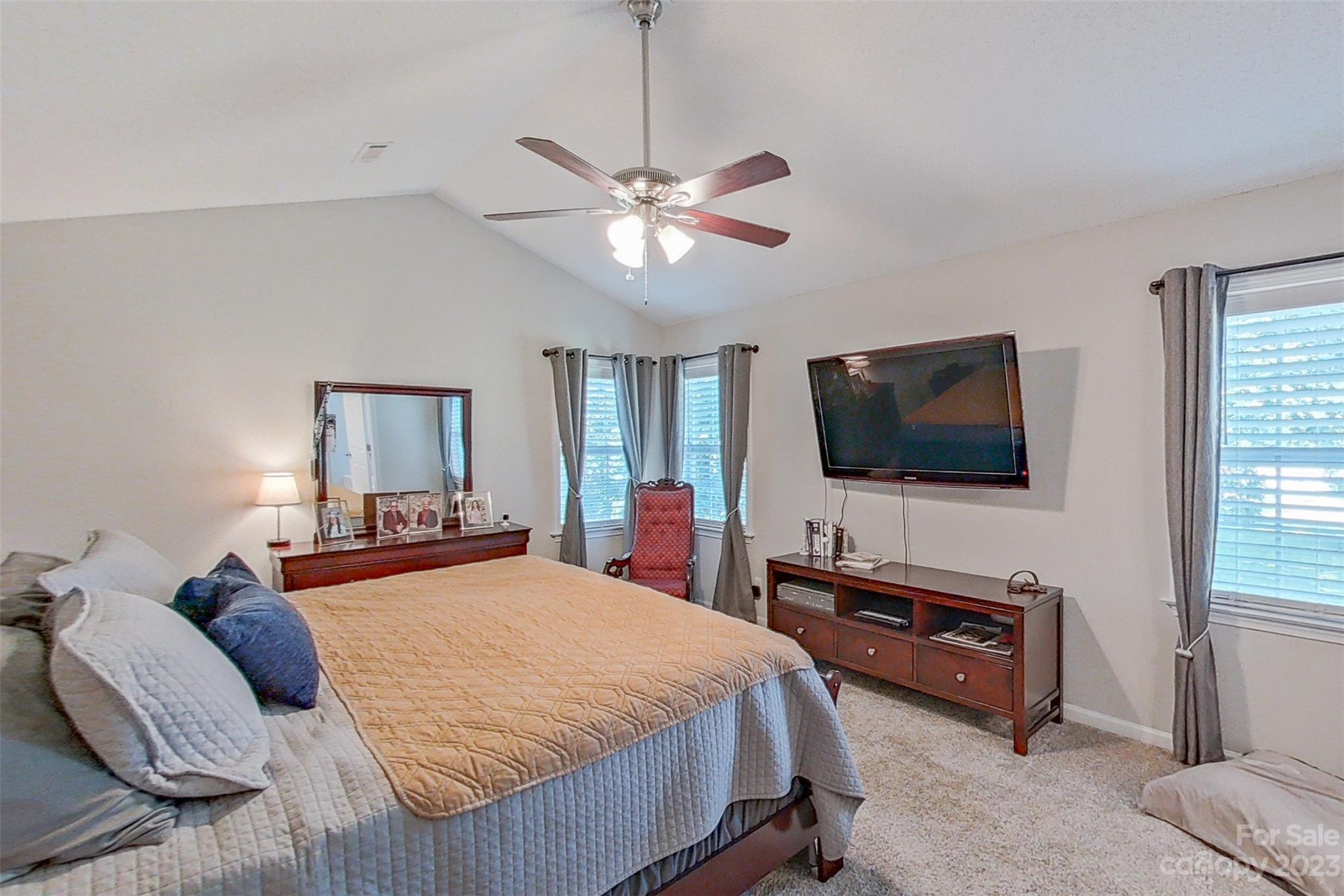 358 Maple Ridge Circle Salisbury, NC 28147 - Photo 26 of 48 a bedroom with a bed and a flat screen tv