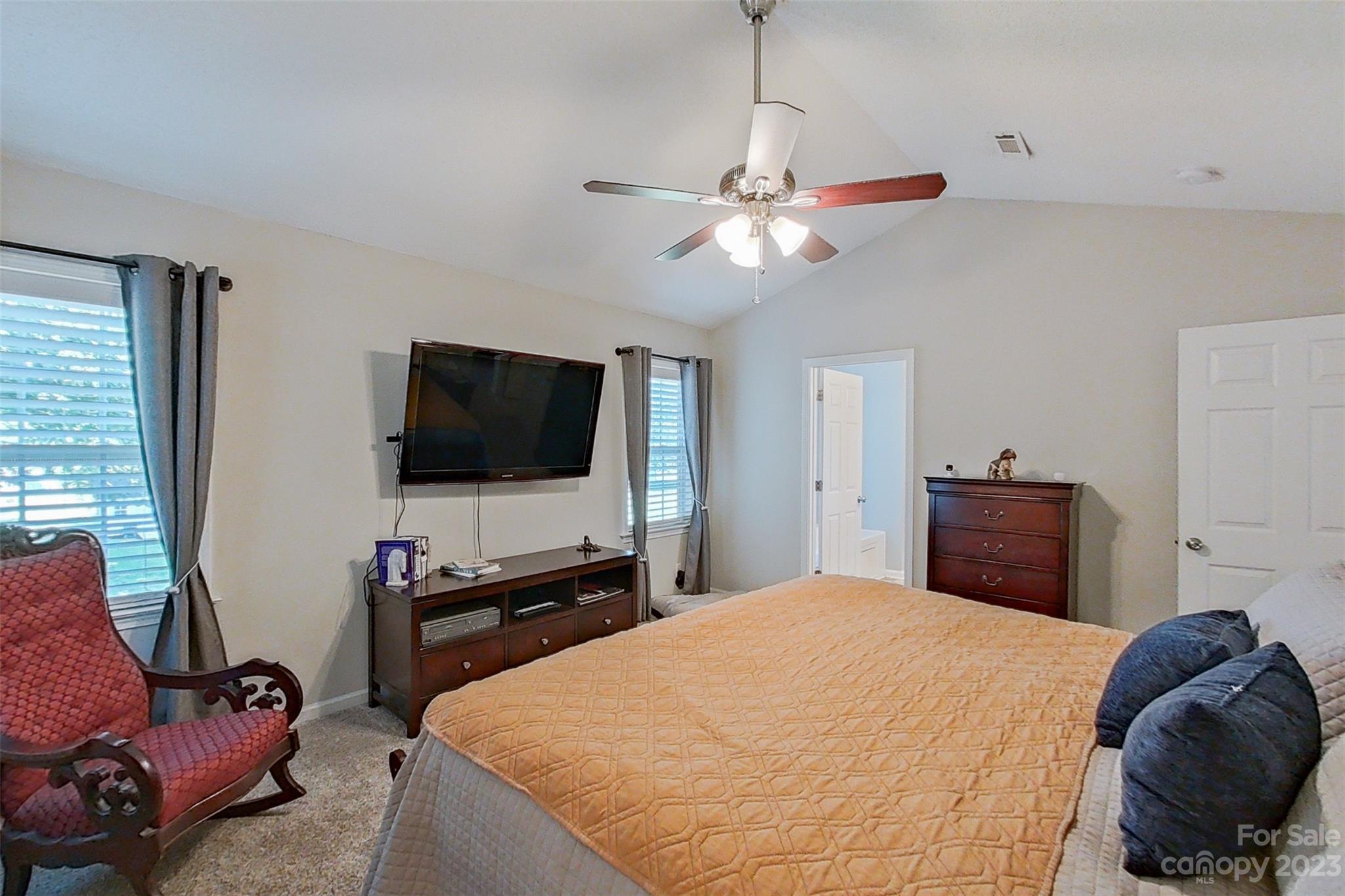 358 Maple Ridge Circle Salisbury, NC 28147 - Photo 27 of 48 a bedroom with a bed and a flat screen tv