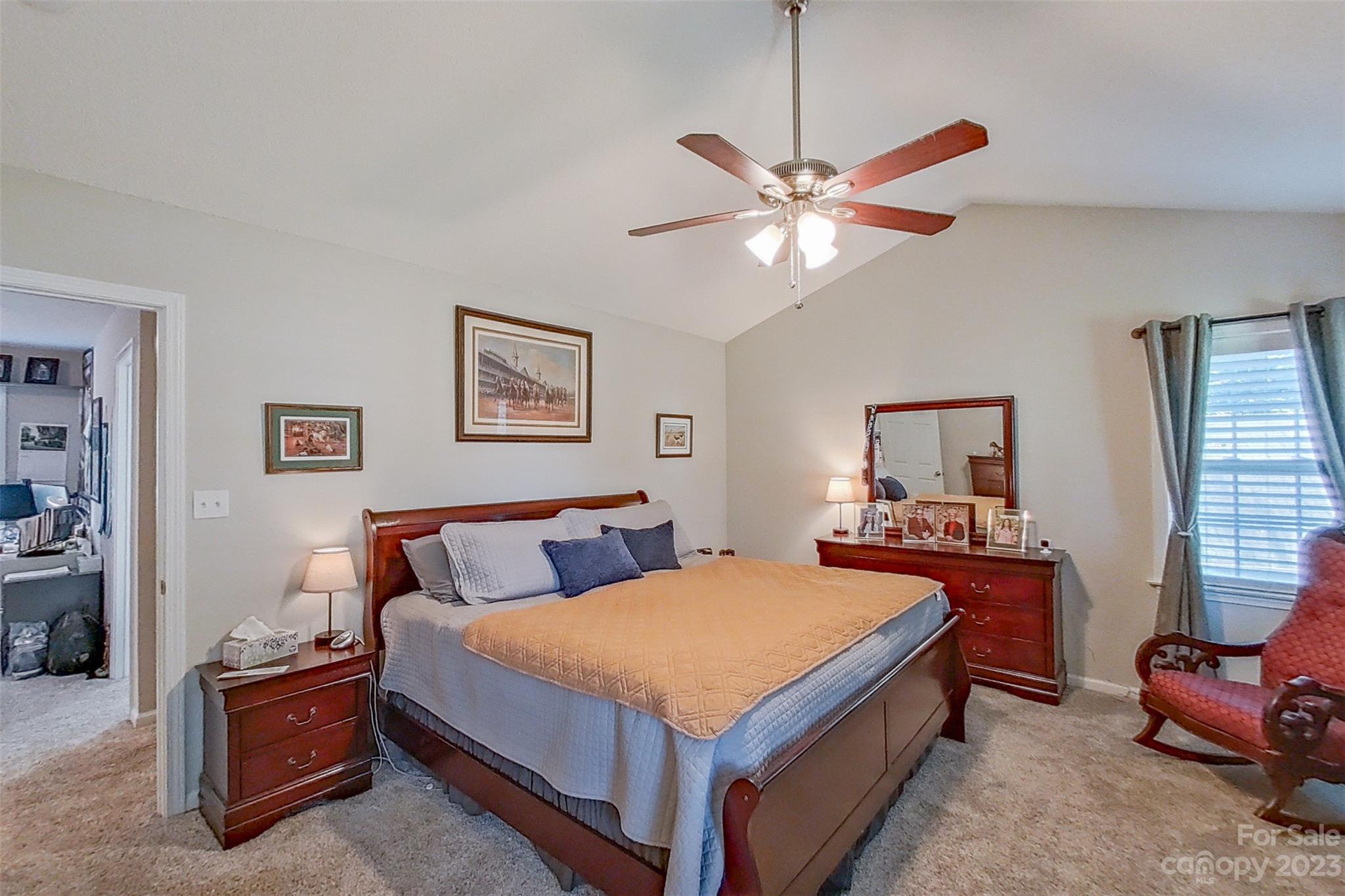 358 Maple Ridge Circle Salisbury, NC 28147 - Photo 28 of 48 a bedroom with a bed and a chandelier
