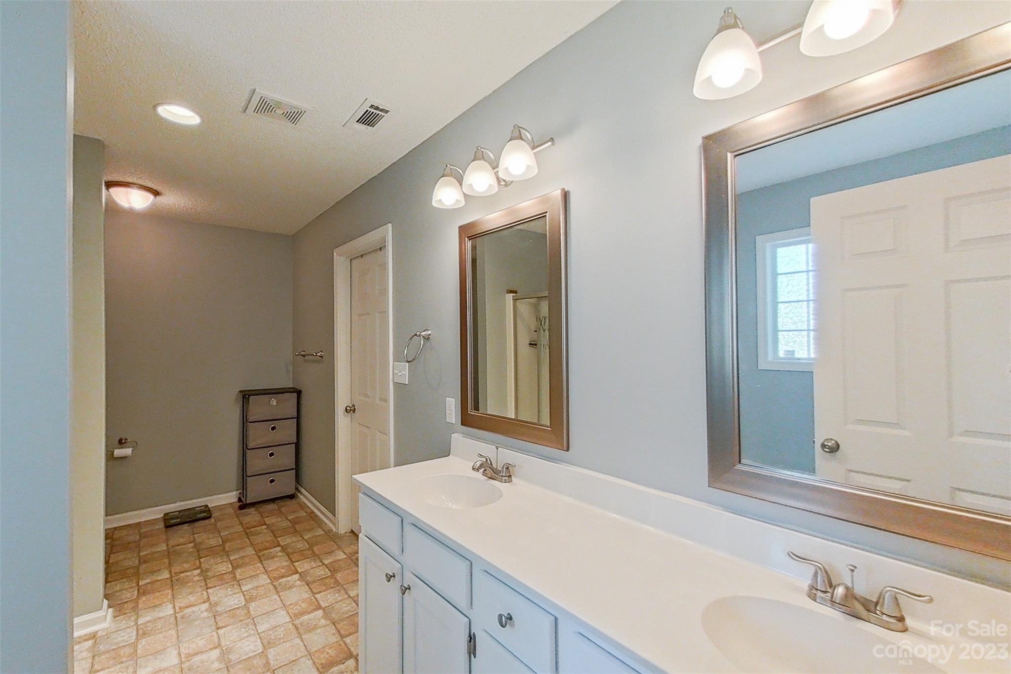 358 Maple Ridge Circle Salisbury, NC 28147 - Photo 29 of 48 a bathroom with a sink and a mirror