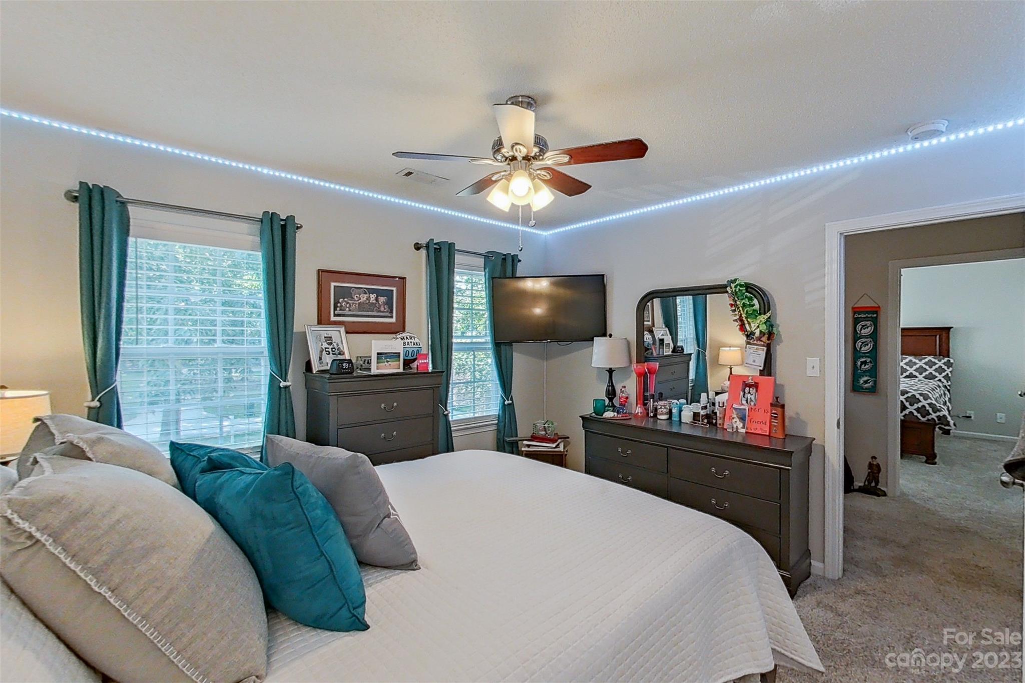 358 Maple Ridge Circle Salisbury, NC 28147 - Photo 36 of 48 a bedroom with a bed a mirror and desk
