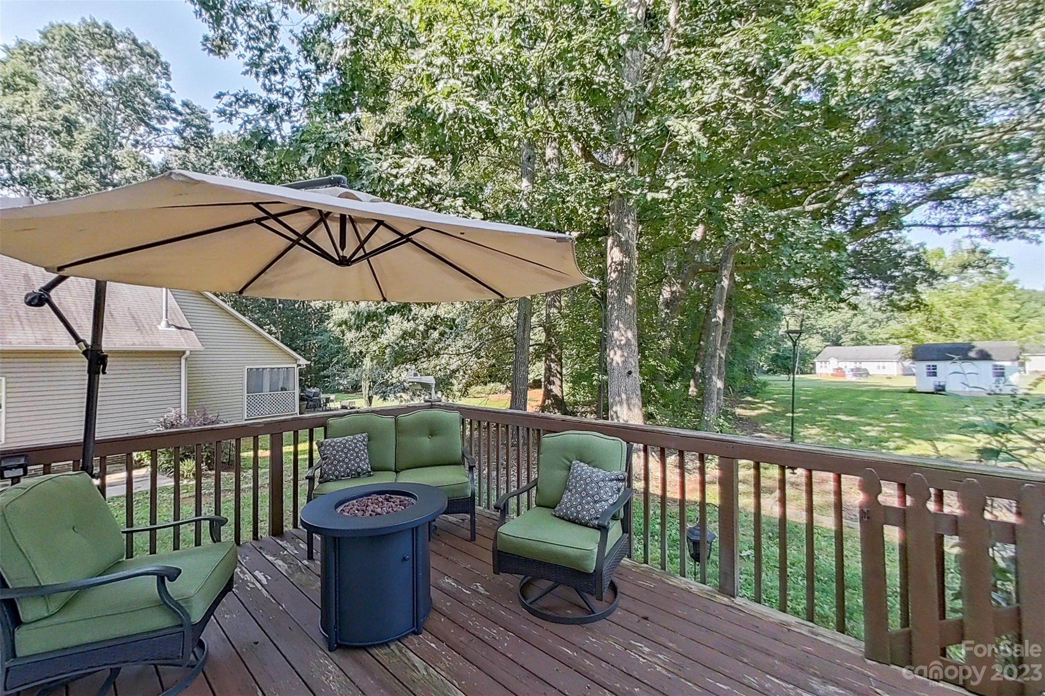 358 Maple Ridge Circle Salisbury, NC 28147 - Photo 39 of 48 a view of a deck with furniture and a backyard
