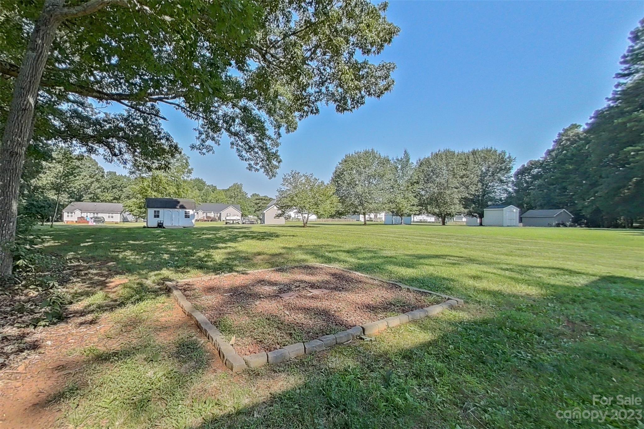 358 Maple Ridge Circle Salisbury, NC 28147 - Photo 42 of 48 a view of a field with tree s