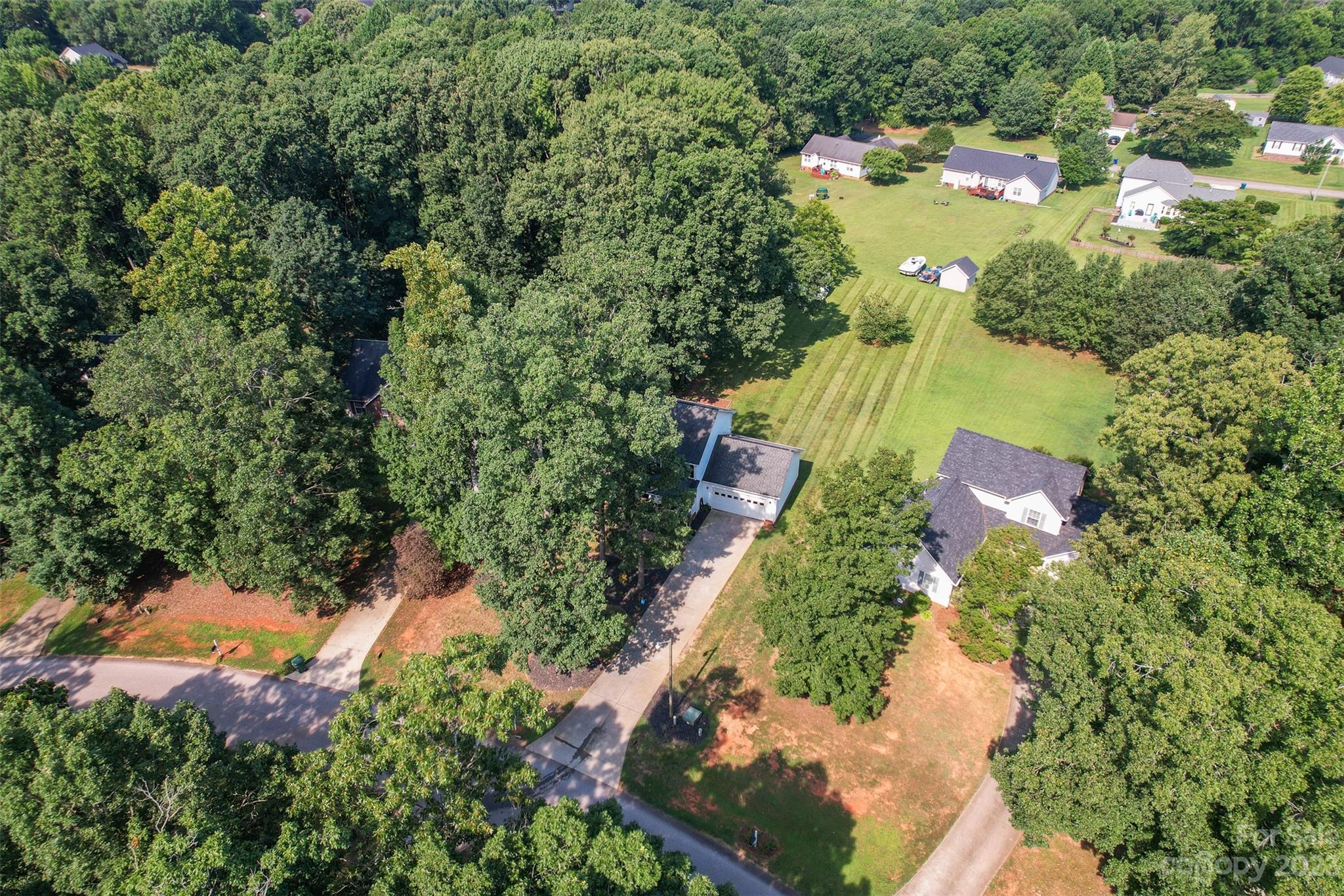 358 Maple Ridge Circle Salisbury, NC 28147 - Photo 5 of 48 an aerial view of a house with a yard and lake view