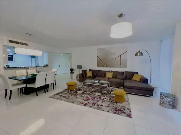 a living room with furniture and a table