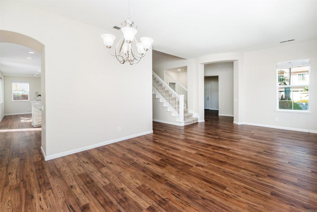 1577 Archer Road San Marcos, CA 92078 - Photo 11 of 53 a view of an empty room with wooden floor and a window