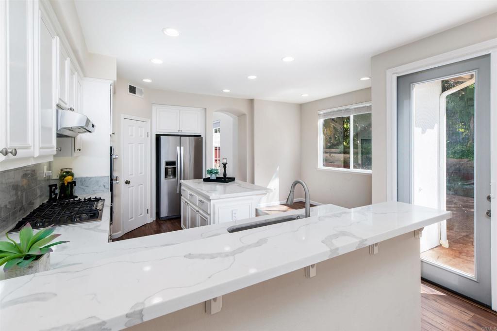 1577 Archer Road San Marcos, CA 92078 - Photo 14 of 53 a large white kitchen with a large window