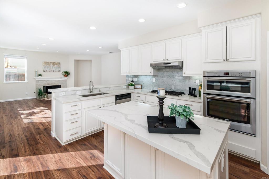 1577 Archer Road San Marcos, CA 92078 - Photo 15 of 53 a kitchen with white cabinets and appliances