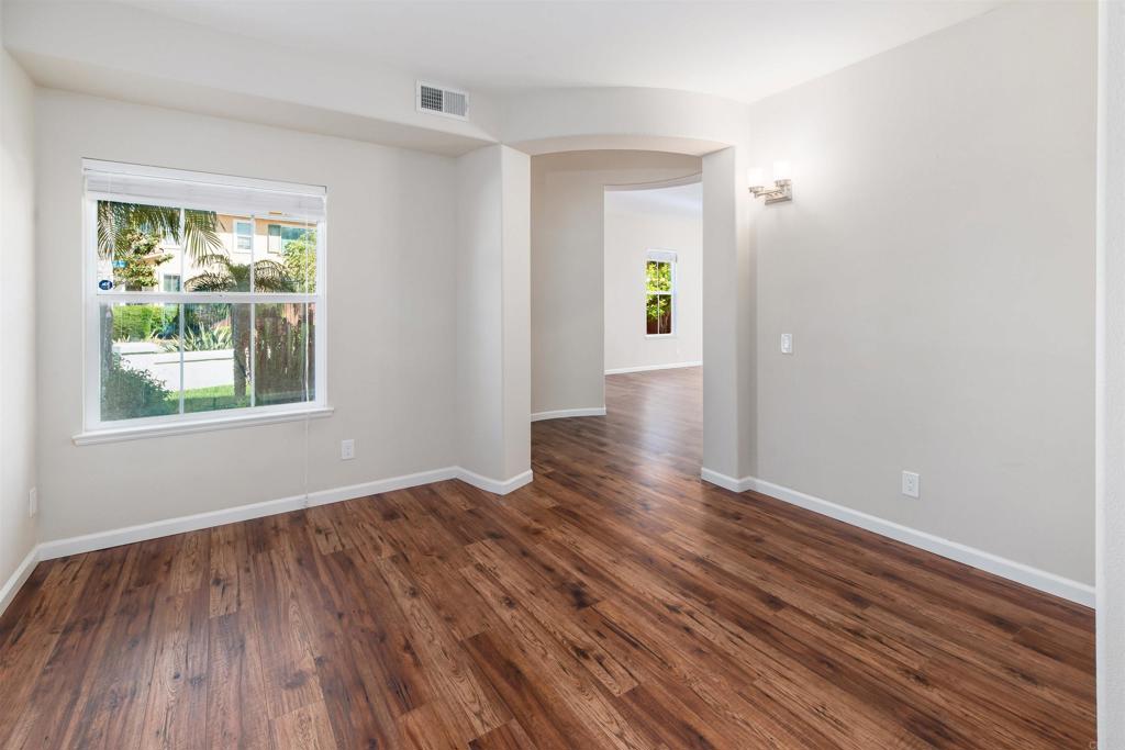 1577 Archer Road San Marcos, CA 92078 - Photo 22 of 53 a view of an empty room with wooden floor and a window