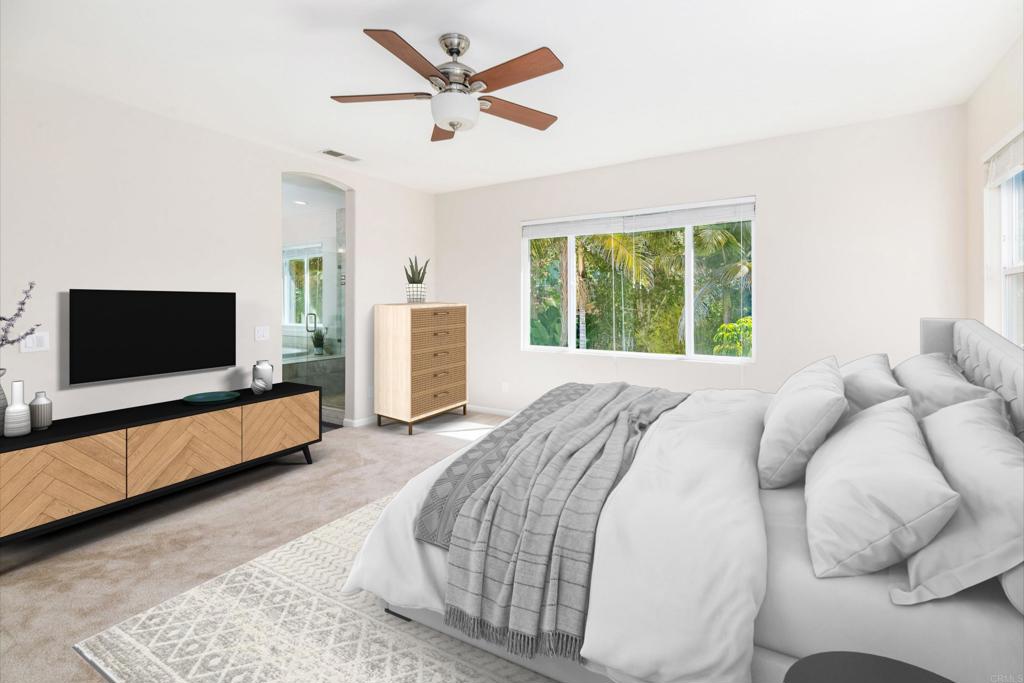 1577 Archer Road San Marcos, CA 92078 - Photo 25 of 53 a bedroom with a bed and a flat screen tv