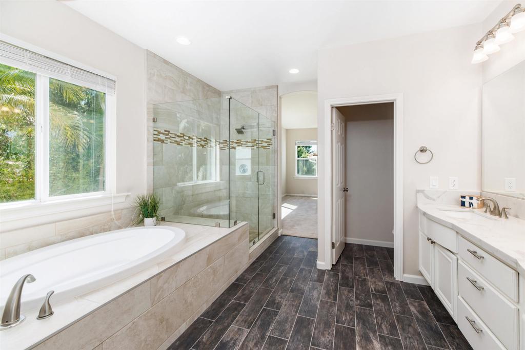 1577 Archer Road San Marcos, CA 92078 - Photo 28 of 53 a bathroom with a granite countertop tub sink and mirror