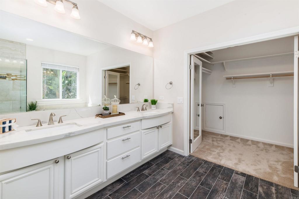 1577 Archer Road San Marcos, CA 92078 - Photo 29 of 53 a spacious bathroom with a double vanity sink mirror and next to a window