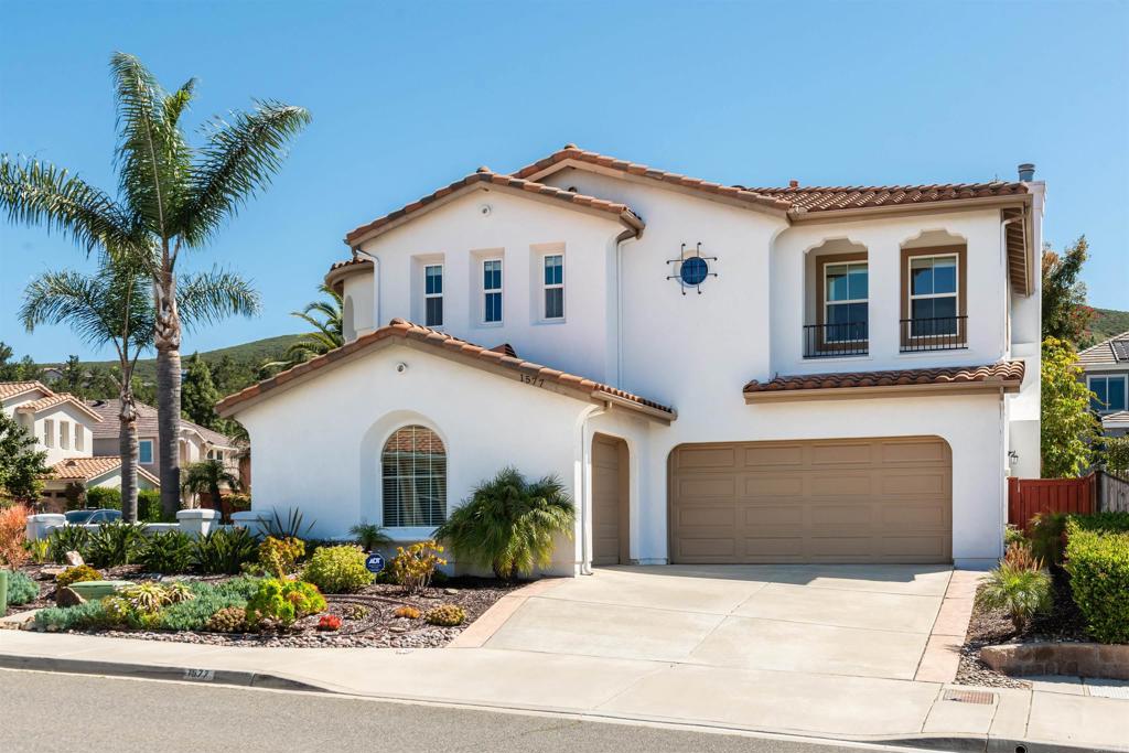 1577 Archer Road San Marcos, CA 92078 - Photo 3 of 53 a front view of a house with a yard and garage