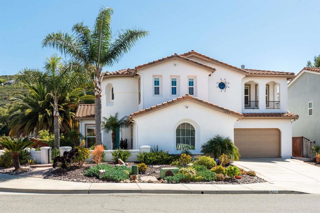 1577 Archer Road San Marcos, CA 92078 - Photo 53 of 53 a view of a white house with a yard and palm trees