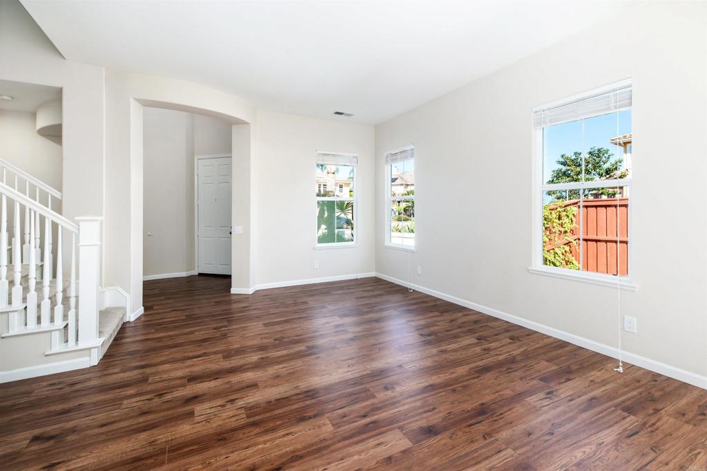 1577 Archer Road San Marcos, CA 92078 - Photo 8 of 53 an empty room with wooden floor and windows