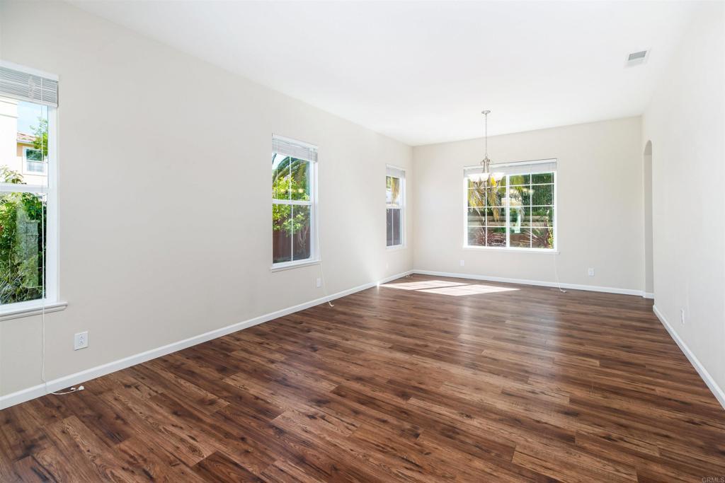 1577 Archer Road San Marcos, CA 92078 - Photo 9 of 53 an empty room with wooden floor and windows