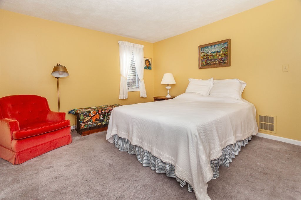3 Potter Pond, Unit 3 Lexington, MA 02421 - Photo 12 of 20 a bedroom with bed and window