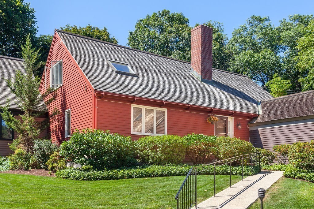 3 Potter Pond, Unit 3 Lexington, MA 02421 - Photo 2 of 20 a front view of a house with a garden