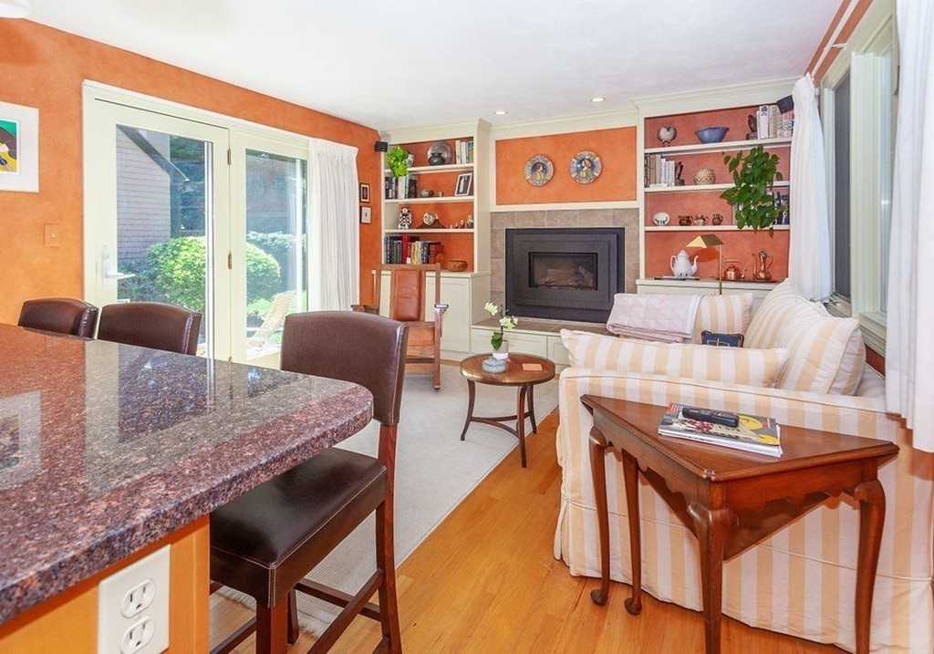 3 Potter Pond, Unit 3 Lexington, MA 02421 - Photo 5 of 20 a living room with furniture and a fireplace