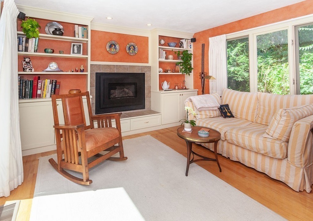 3 Potter Pond, Unit 3 Lexington, MA 02421 - Photo 6 of 20 a living room with furniture and a fireplace