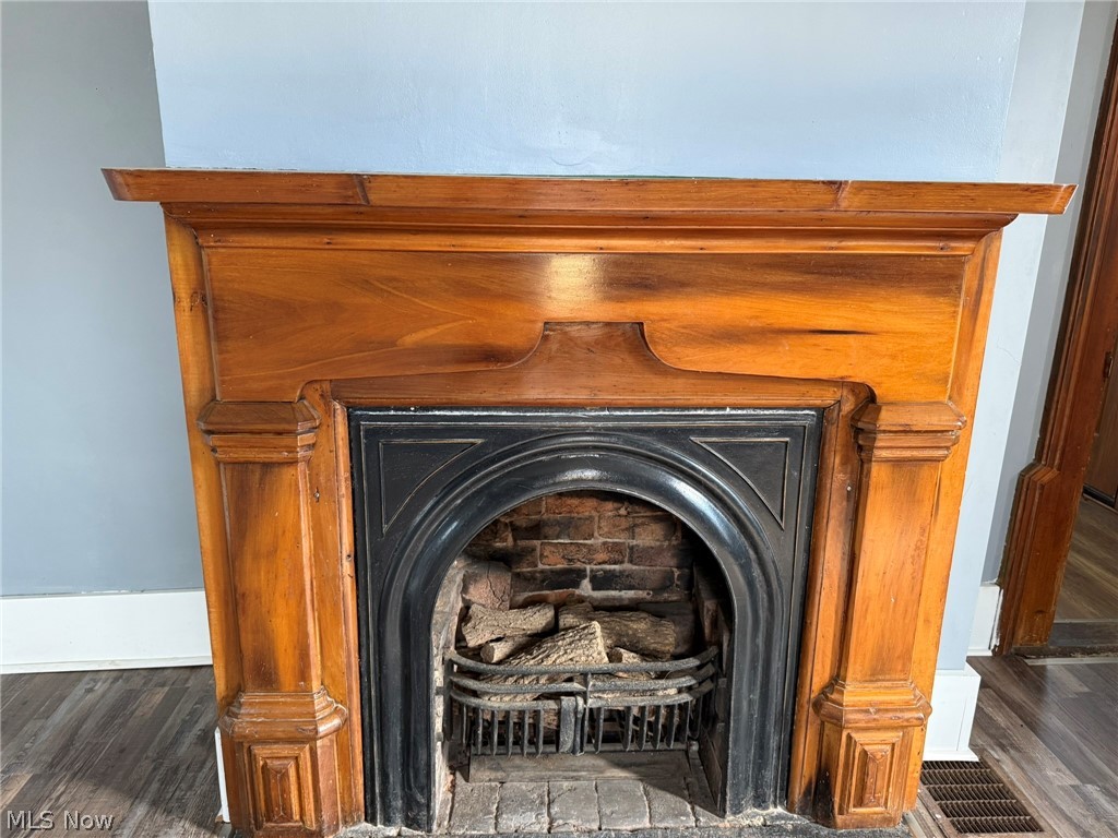 23033 Cadiz Road Freeport, OH 43973 - Photo 10 of 31 Detailed view of wood finished floors and a fireplace