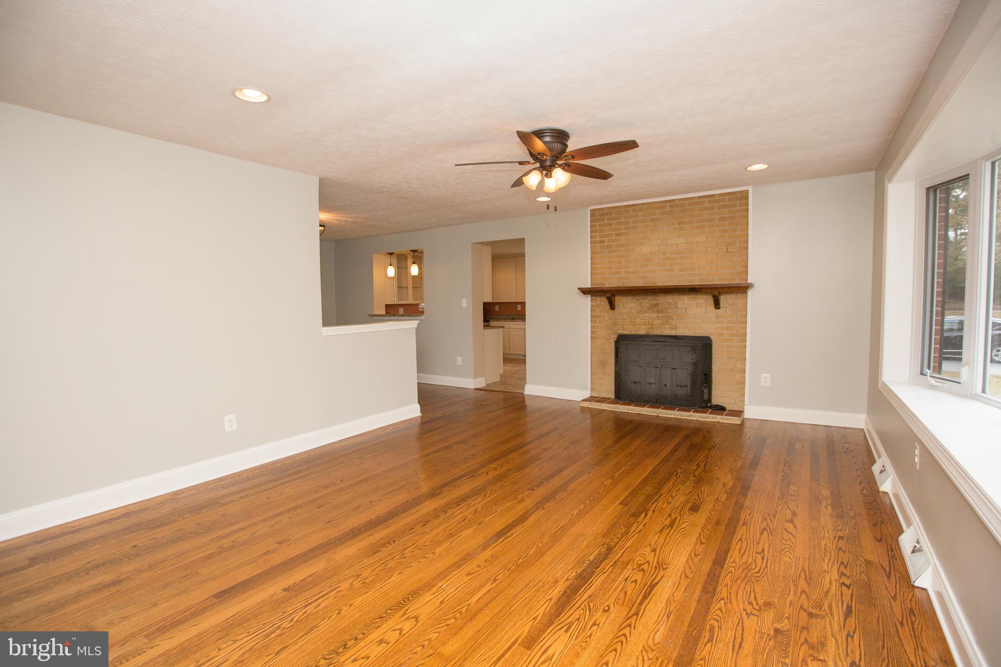 44441 Clarkes Landing Road Hollywood, MD 20636 - Photo 12 of 37 Living Room w/ Fireplace