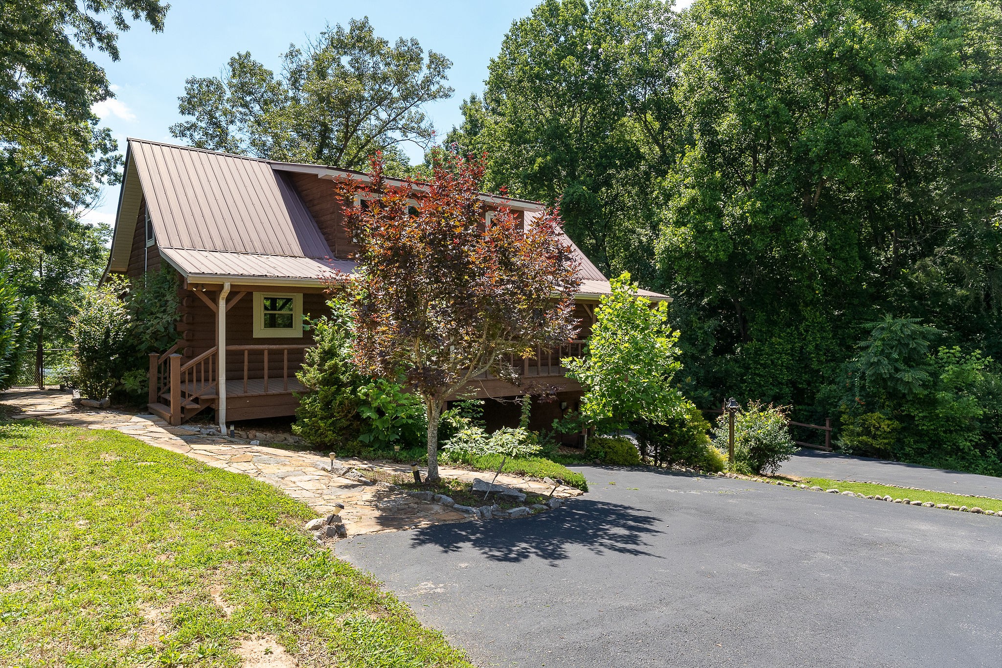 142 Rayahs Way Quebeck, TN 38579 - Photo 44 of 73 a view of a house with backyard and sitting area